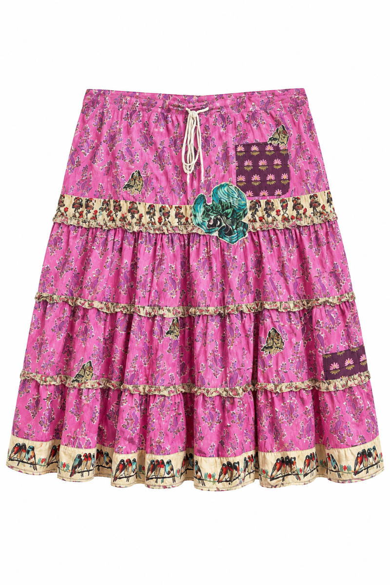 Trestles Clothing Company pink cotton patchwork midi skirt with ruffle tiers, drawstring waist, and bird print trim.